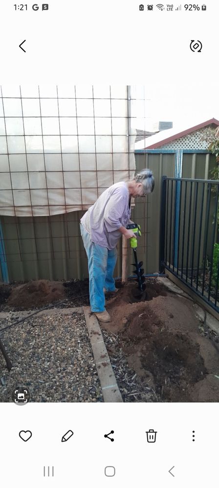 This Old girl digging post holes the easy way