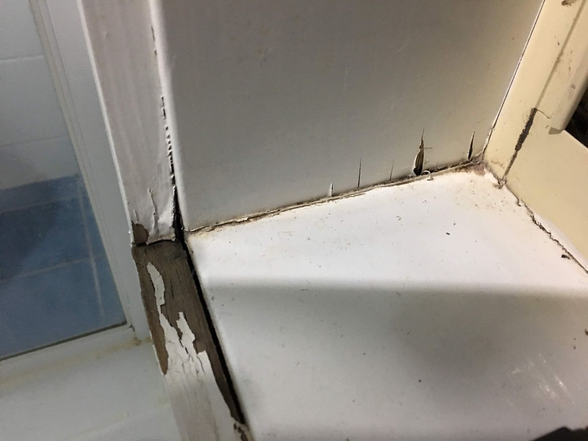 The water damaged window frame