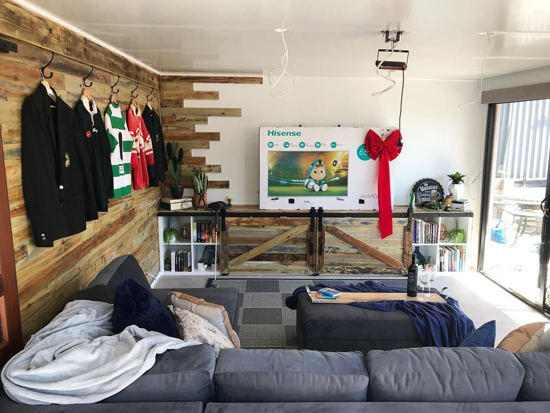 barn door tv cabinet doors/benchtop and feature wall in mulit coloured paint and stain sanded back and sealed