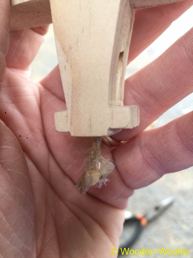 4mm dowel hot glued to string to act as stay