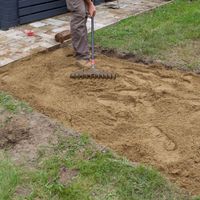 5.1 Spread paving sand with a rake.jpg