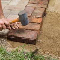 7. Start laying pavers from one edge.jpg