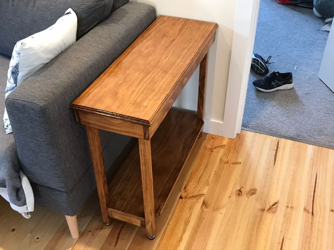 Simple table made for a narrow space.  Table was made from pine that was stained and lacquered.