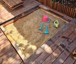 Sandpit with cover built into deck.jpeg