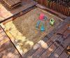 Sandpit with cover built into deck.jpeg
