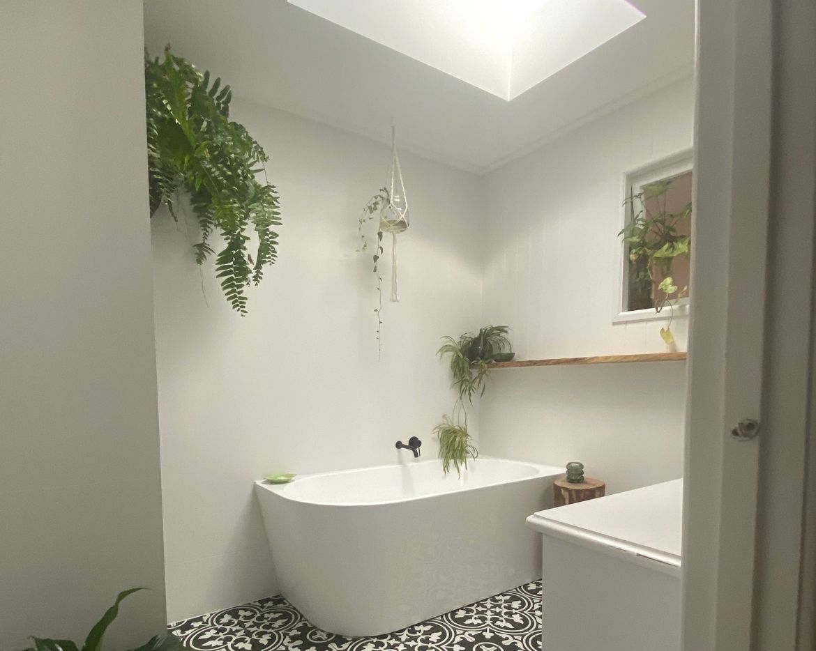 Bathroom reno with VJ panelling and tiled floor.jpeg