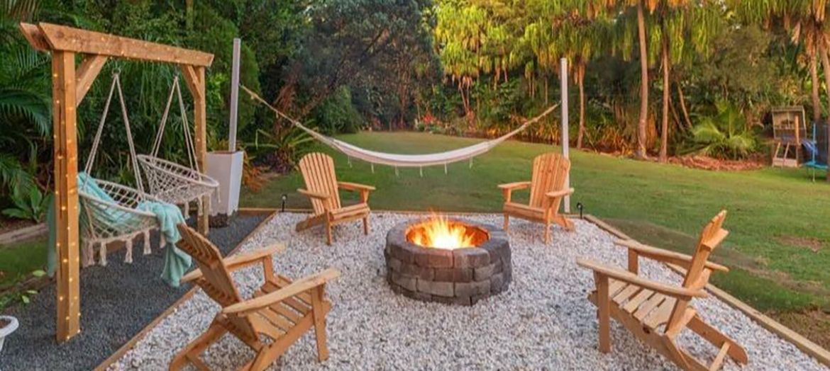 Fire pit with hanging chairs.jpeg