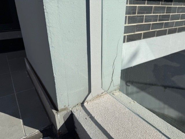Smaller cracks adjacent to the main wall