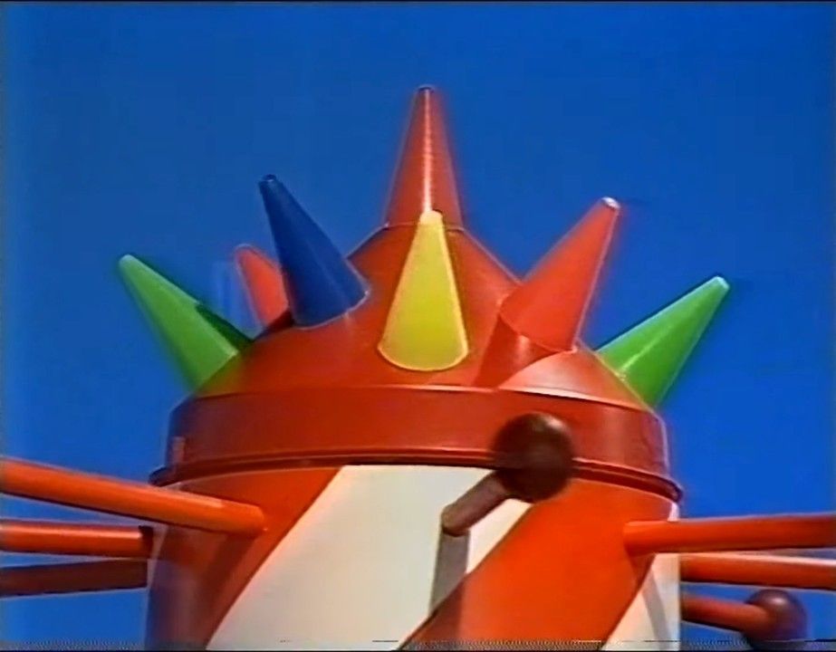 this is the rocket thing with spikes on the cone and balls on wooden cylinder things that make the rocket thing moves round where the trolley is pushed somewhere