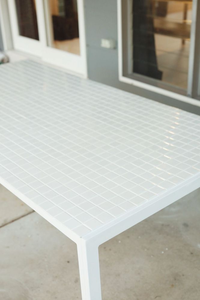 White grid tiled outdoor table