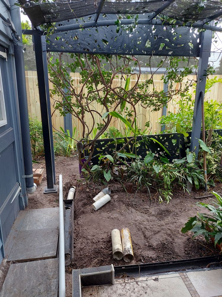 digging up old drainage pipe to replace