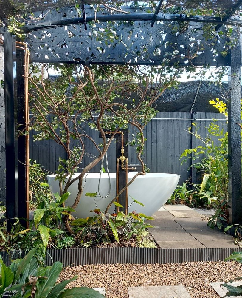the outdoor bathtub is ready for bubbles and bath