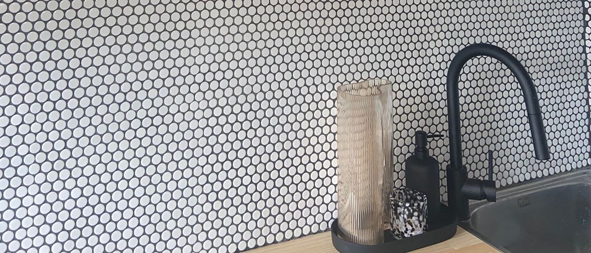 Budget laundry renovation with tiled splashback.jpeg