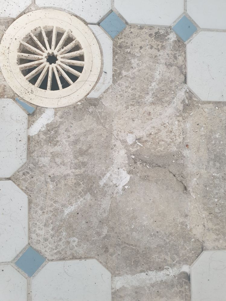 crack in floor under tiles