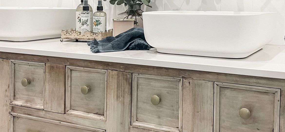 Upcycled cabinet into bathroom vanity.JPG