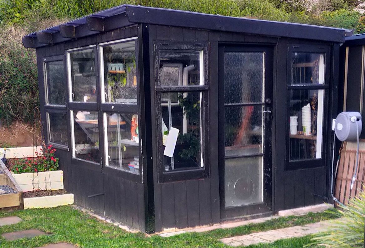 Upcycled self watering glass house.jpg