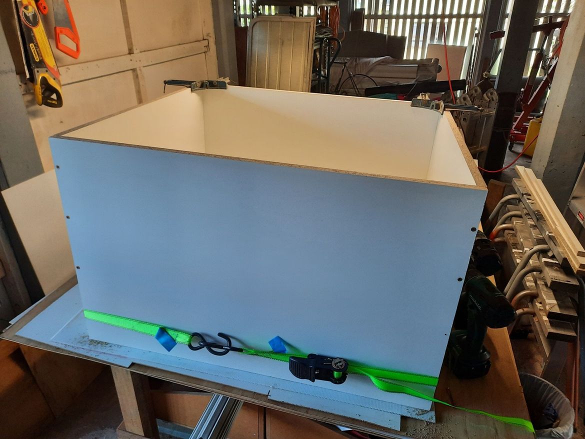 Base cabinet assembly, working solo, ratchet straps helped hold it together