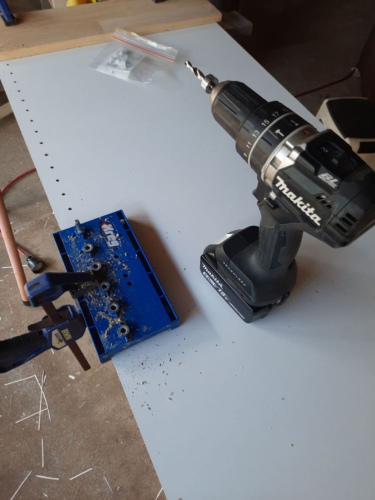 Holes drilled for adjustable shelving