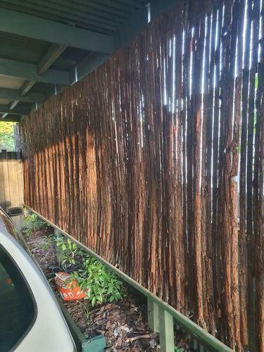 Fence rail + bark screening.