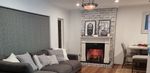 Living room renovation with whitewashed fireplace.jpg