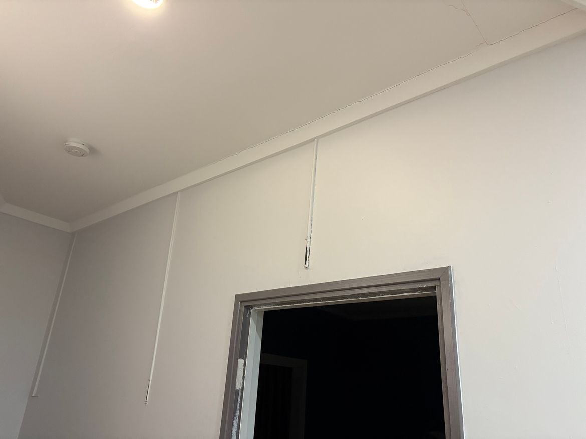 Tubes on kitchen wall above the door to the lounge room