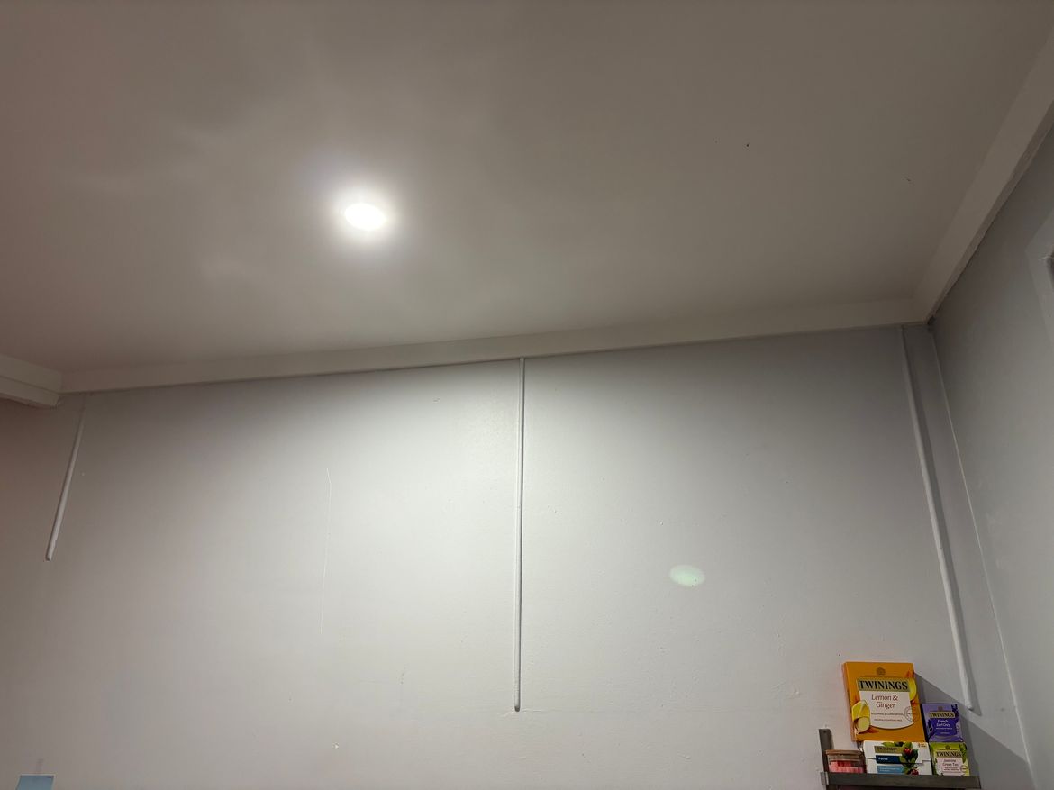 Tubes on kitchen wall backing onto bedroom