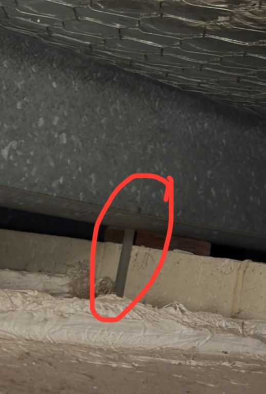 Roof cavity look at the metal thingy that is just left of the door (close up) 2 of 2