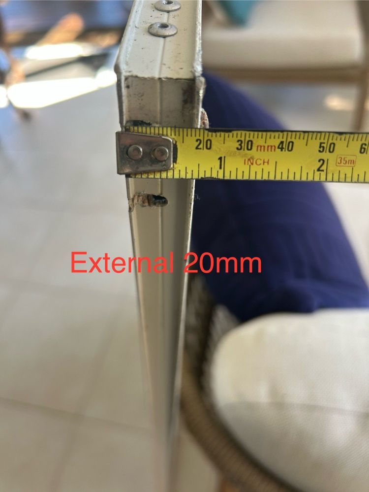 External width of aluminum door frame.