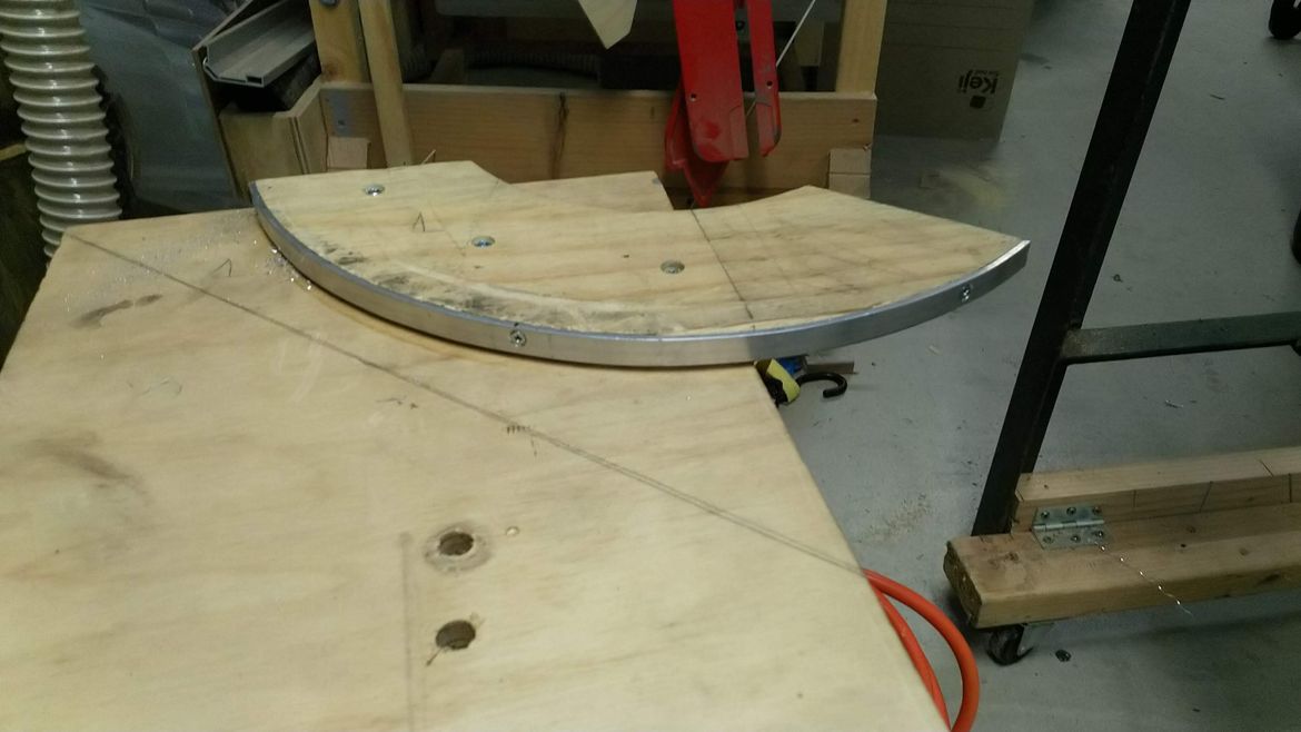 Cut to size, mounted with 3mm aluminium trim for bearings to run on