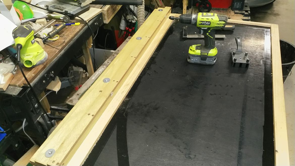 fence rail attached to table top