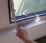 Then peel up the corners to open/close the window.