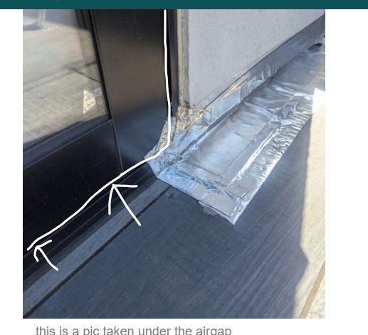 leak occurred where white arrows are pointing.  I used sika flex hc1 i think to fill the gap where the white lines are.