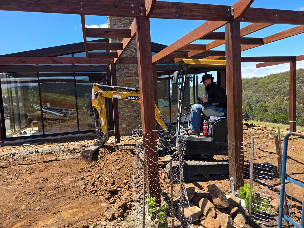 excavator under pergola 1.jpg