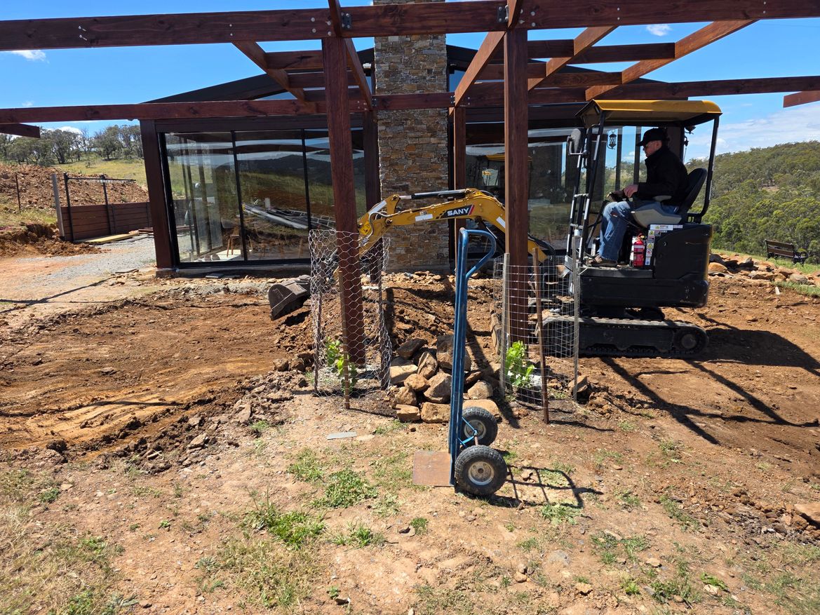 excavator under pergola 2.jpg