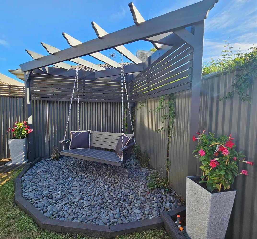 Corner pergola with screening and swing.jpg