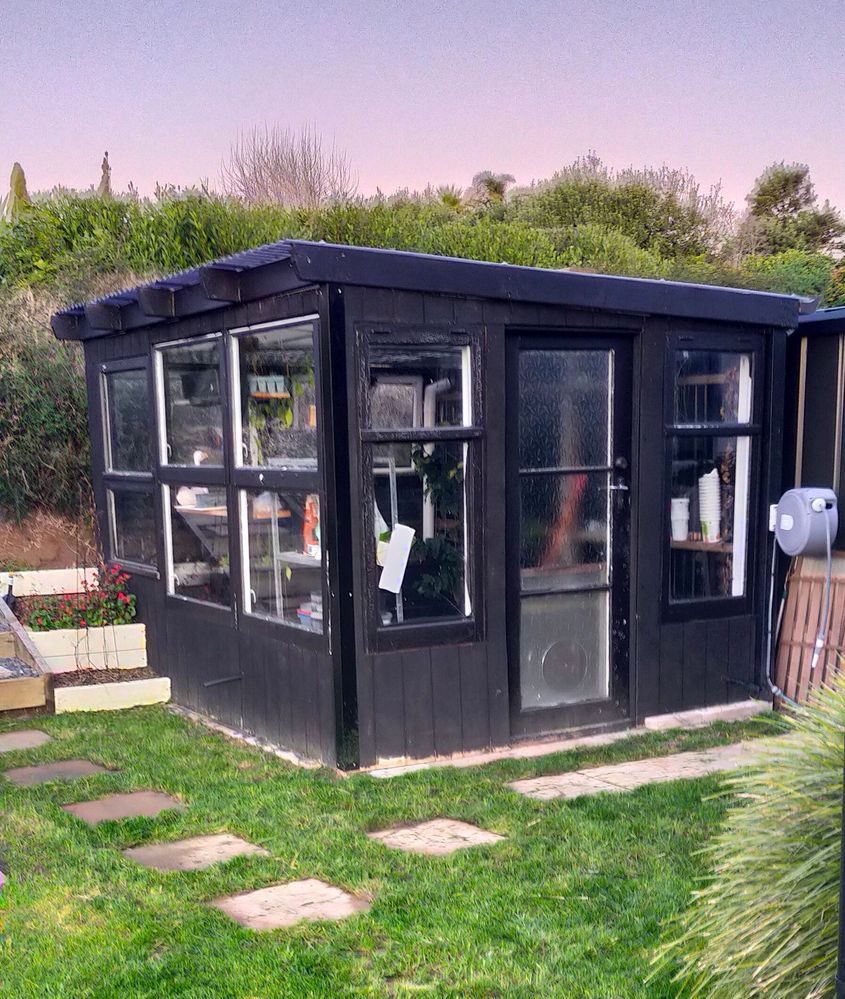 Upcycled self-watering greenhouse.jpg