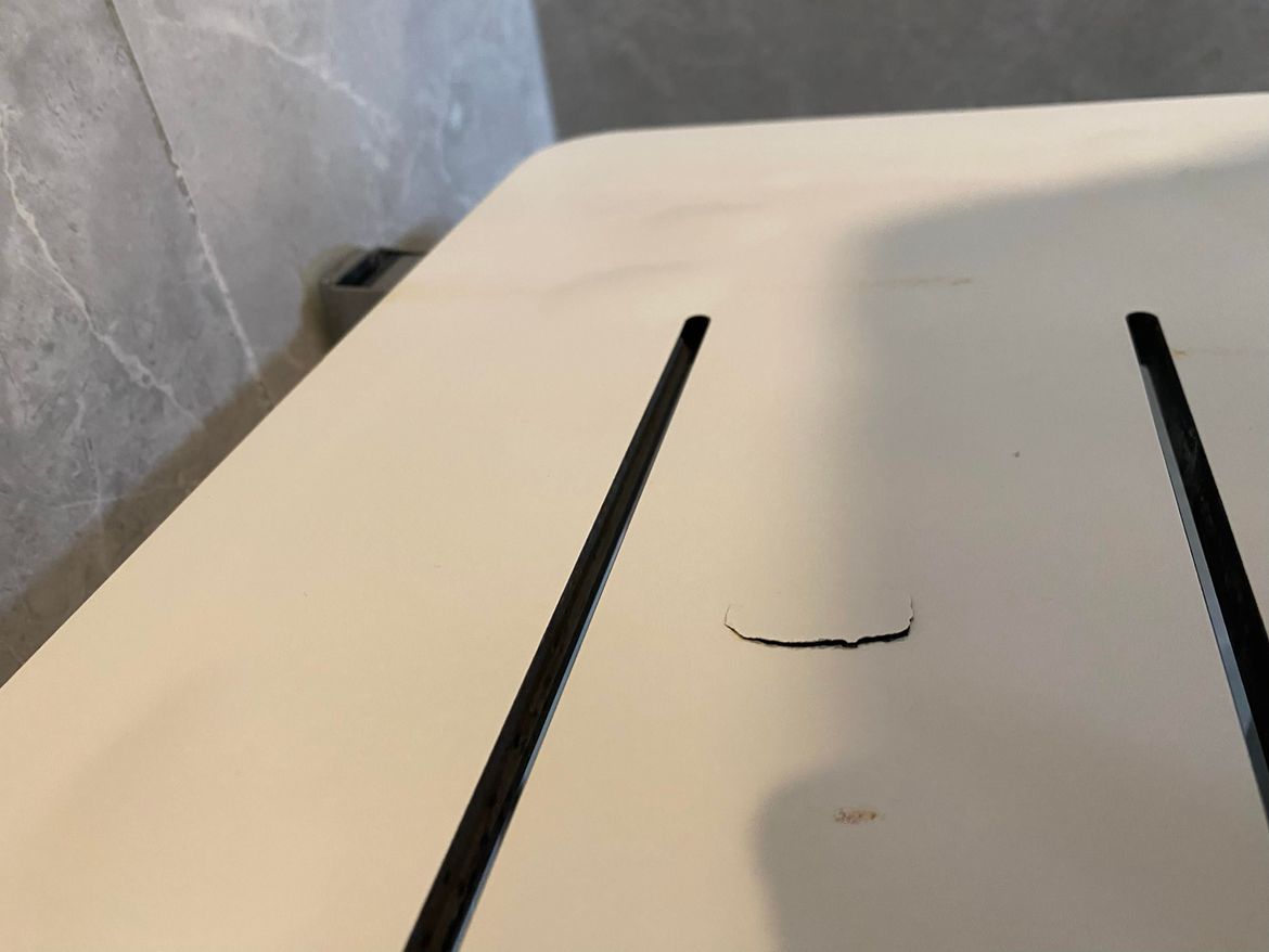 Shower bench ding (angle 2).jpg