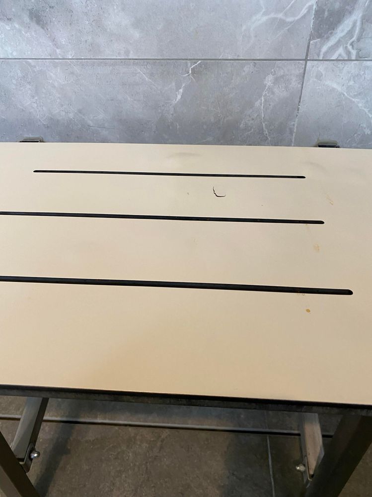 Shower bench ding (angle 1).jpg