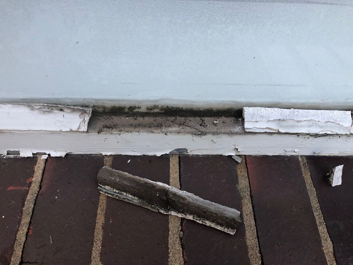 Window and frame with the putty that needs replacing