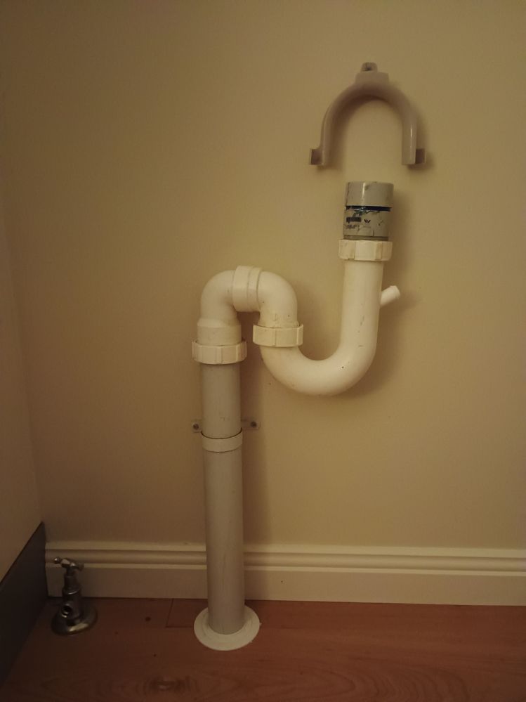 pipe behind dishwasher