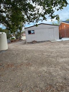 slope on either side of garage.jpeg