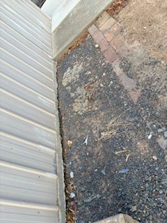 garage at higher level and no measures preventing erosion.jpeg