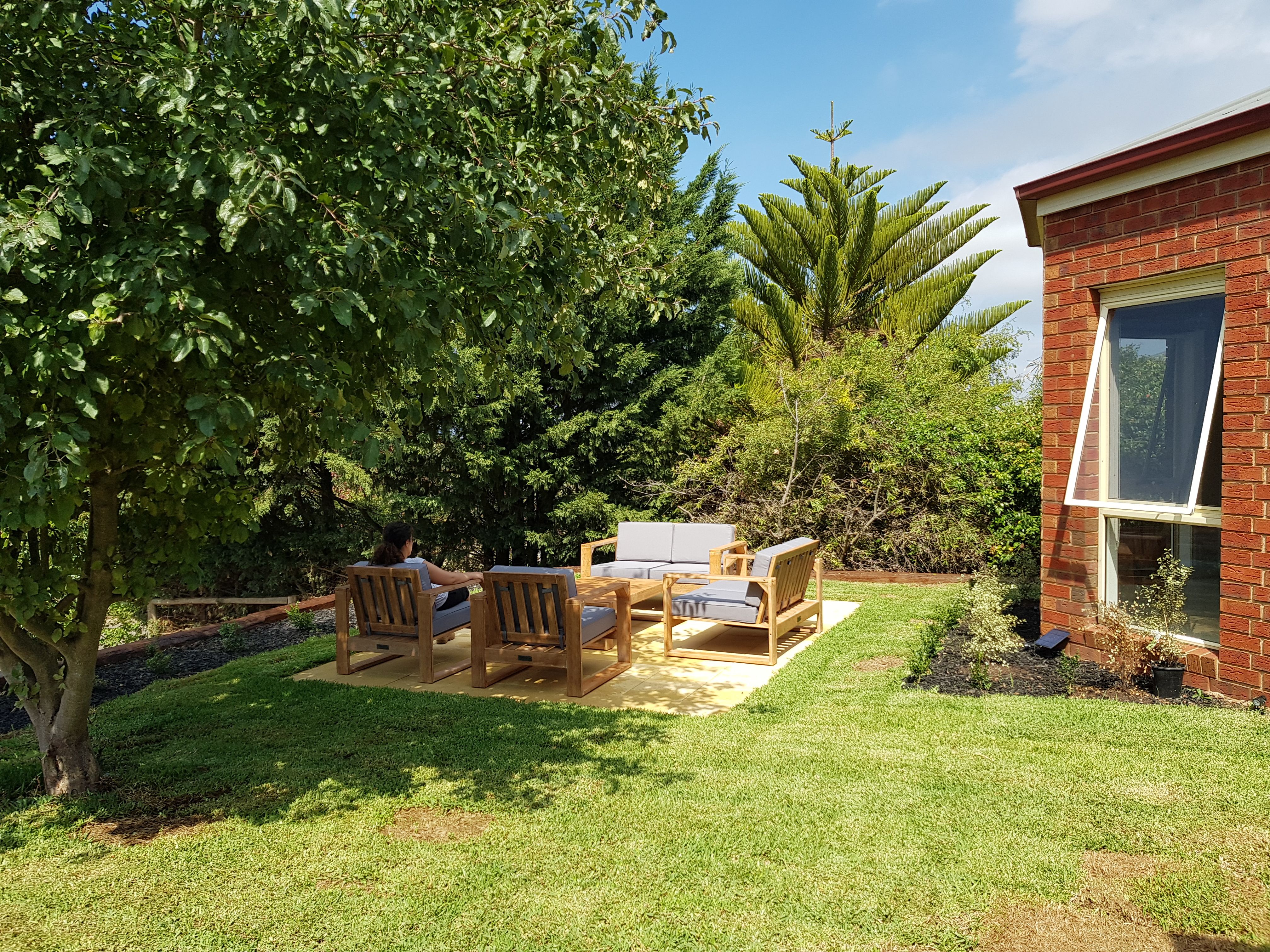 Outdoor paved area with lounge Bunnings community
