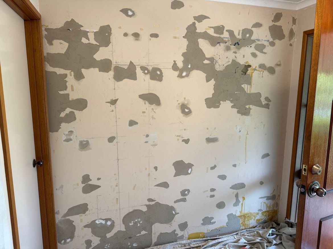 Internal wall after removal of mirror tiles