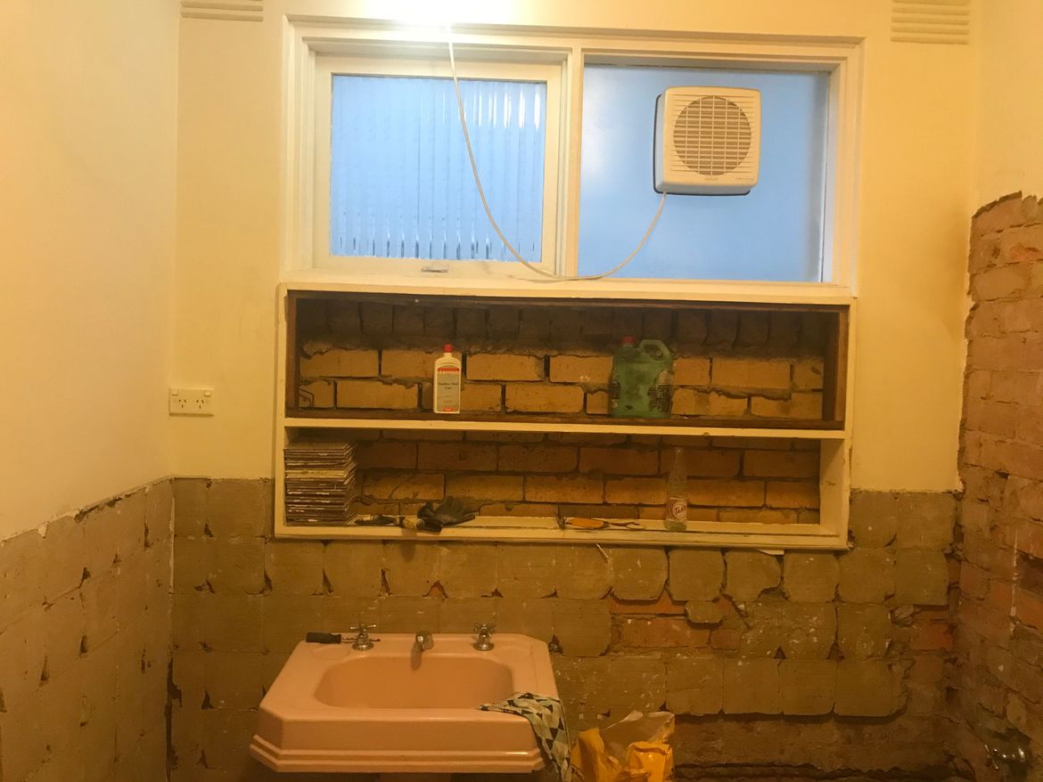 Bathroom cupboard demolished to insert a cavity shelf - probably tiled