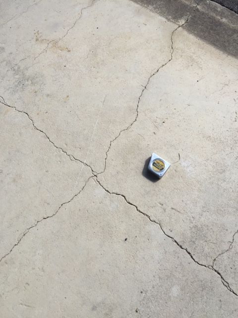 size of cracks in cement, measure tape for scale