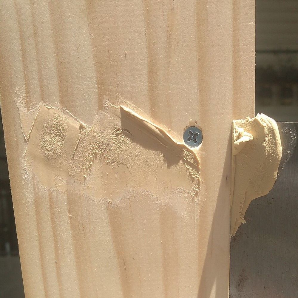 6.1 Filling screw holes with putty.jpg