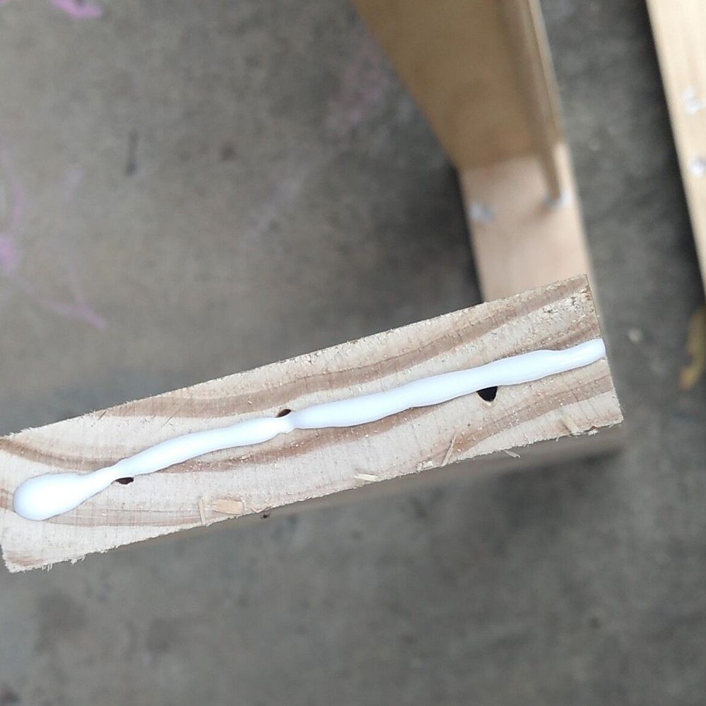 5.3 Applying glue to shelves.jpg