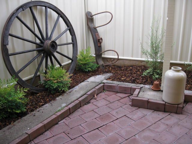 Wagon Wheel, Bullock Yoke & Clay Jug