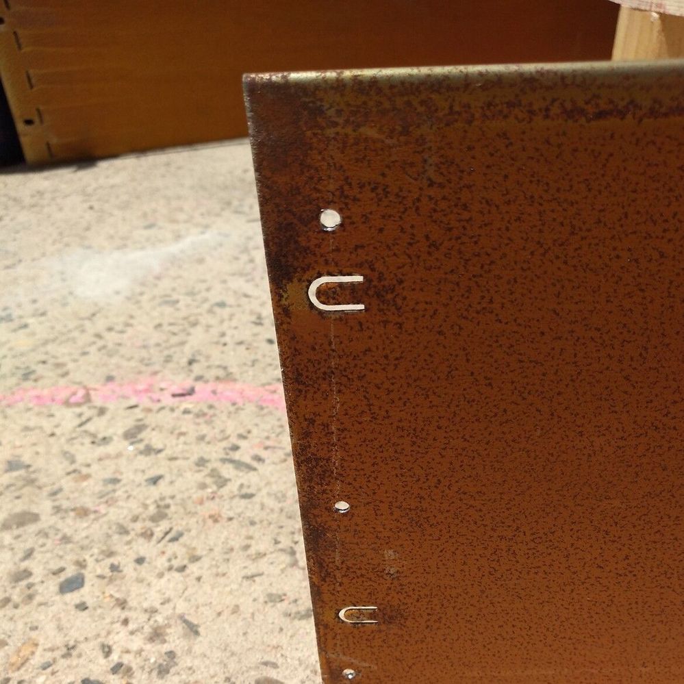 6.3 Pre-drilled holes in end of edging.jpg